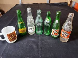 lot 143 image: Vintage Soda Bottle Collection with Promotional Mug