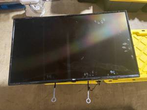 lot 2 image: LG Flat Screen TV with Wall Mount and Slight Screen Damage