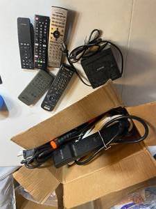 lot 73 image: Assorted Electronic Cords and Remote Controls
