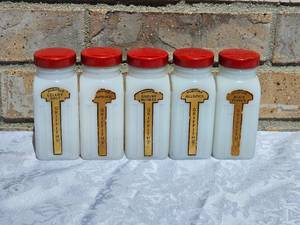lot 5 image: Griffiths Set of Five Milk Glass Spice Bottles