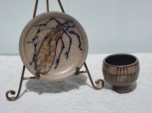 lot 97 image: Vintage Rock Hard Stoneware Studio Art Ceramic Cup & Saucer with Handpainted Cicada Design