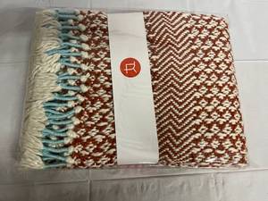 lot 260 image: Burnt Sienna, White, and Teal Knitted Throw Blanket