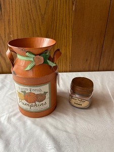 lot 169 image: Milkcan and a candle...