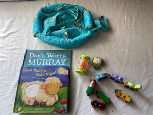 lot 211 image: Johnny jump up, books and toys...