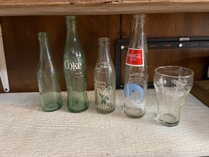 lot 277 image: Coca Cola bottles and glassware...