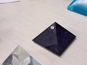 lot 71 image: Plastic Pyramid Table Dcor