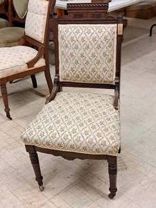 lot 105 image: Padded Wood Rolling Dining Side Chair