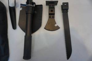 lot 18 image: Folding Camp Shovel With Interchangeable Saw Blade, Hatchet, and Pick Blade With Sheath