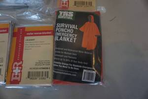 lot 127 image: Large Lot of Survival Rescue Blankets, Sleeping Bag, and Survival Parka