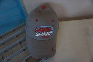 lot 136 image: Lid Locker Model 1800 Plastic Tackle Box With Lazer Sharp Hooks Baseball Cap