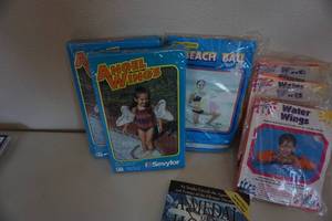 lot 156 image: Lot of Inflatable Beach Water Wings, Beach Ball With John Horton Medal of Honor Novel