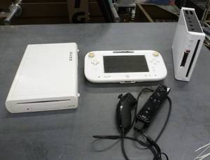 lot 40 image: Two Nintendo Wii systems and 2 controllers