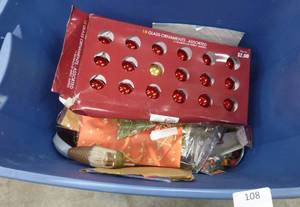 lot 108 image: Large tote of craft ribbons, christmas, and a rubbermaid hanging christmas storage bag