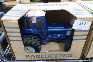lot 112 image: Pacesetter Vodka decanter of a Ford Tractor, empty, the muffler is in the box, just needs to be glued back on