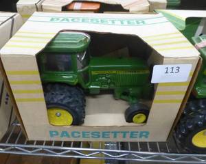 lot 113 image: Pacesetter Vodka decanter of a John Deere Tractor, empty, the muffler is in the box, just needs to be glued back on
