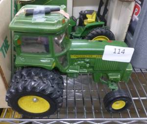 lot 114 image: Pacesetter Vodka decanter of a John Deere Tractor, empty, the muffler just needs to be glued back on, no box for this one