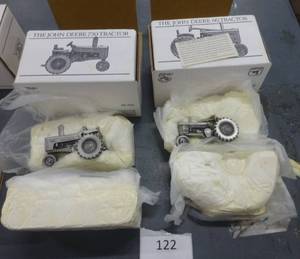 lot 122 image: John Deere Pewter collector series tractors 730 and 60, guessing these are 148 or 160 scale