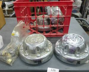 lot 126 image: Dodge Ram wheel covers and lug nuts