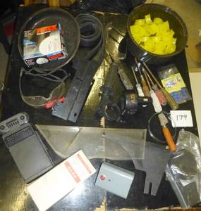 lot 179 image: Screwdrivers, saw blade guard, bike tire, new flow switch