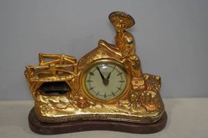 lot 17 image: Vintage United Huck Finn Fisherman Mantle Clock