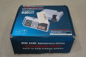 lot 230 image: Mini Anniversary Edition Game System with 620 Built in Classic Games