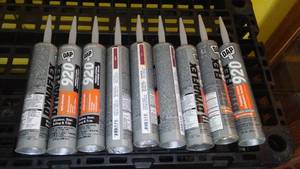 lot 595 image: DAP 920 Dynaflex Caulk (9 Tubes)