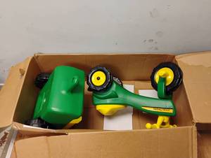 lot 28 image: NEW JOHN DEERE PEDAL TRACTOR AND TRAILER