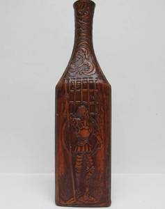 lot 69 image: Mid Century Tooled Leather on Glass Bottle