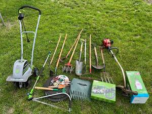 lot 12 image: Gardening Lot - Rototiller, Weed Trimmer, Rakes, Shovels, Hoes, Hand Tools, Hoses, Sprayer, Sprinkler System