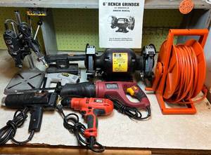 lot 26 image: Corded Power Tool Lot - Black & Decker 5.2AMP Drill, Chicago Reciprocating Saw, Black & Decker Sander, Tool Shop 6 Bench Grinder, Black & Decker Heat Gun, Dremel Moto-Tool with Stand, Stanley electric stapler, reel and extension cord