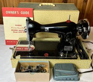 lot 46 image: Montgomery Ward Precision Round Bobbin Sewing Machine Model URR 188 with case, manual and famous buttonhole woker foot