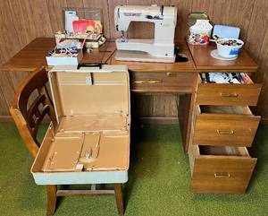 lot 45 image: Elna Supermatic Sewing Machine Table and Chair,  Machine Carrying Case with vintage buttons and wood spools