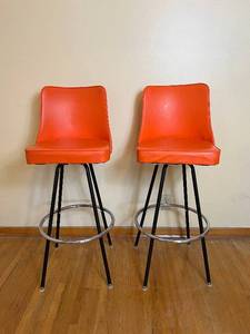 lot 49 image: Vintage MCM Orange Swivel Bar Stools
