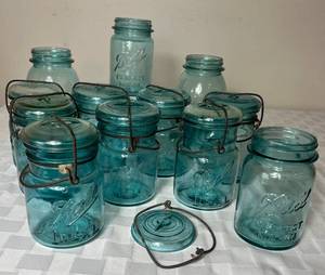 lot 51 image: Vintage Blue McDonald and Ball Mason Jars many with wire and glass lids - 12 total