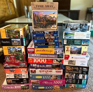 lot 81 image: 1000 Piece Jigsaw Puzzle Assortment - 31 Boxes