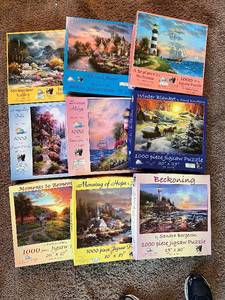 lot 78 image: SunsOut 1000 piece Jigsaw Puzzles - 9 Total