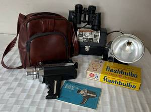 lot 97 image: Kodak Brownie Hawkeye Camera with Bulbs, Bell & Howell Focus-Matic 672Xl Movie Camera and Bushnell Center Focus Binoculars