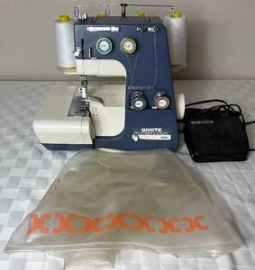 lot 93 image: White Superlock 534 Serger Sewing Machine with Foot Pedal