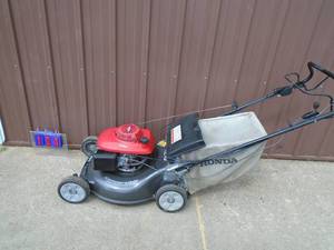Honda self propelled convertible mower. Used condition. Tested & works. As shown.