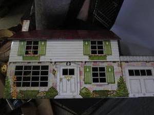 lot 1 image: vintage metal doll house