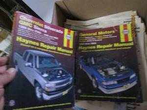 lot 54 image: lot of haynes manuals and newspapers from the twins winning the world series