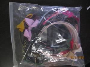 lot 144 image: 18 pack of childrens head bands...