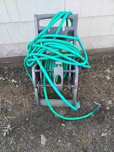 lot 457 image: Hose Holder With Hose