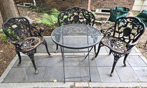 lot 134 image: A Wonderful Rose Motif Cast Iron Patio Set