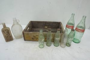 lot 311 image: Nesbitts Crate and variety of glass bottles