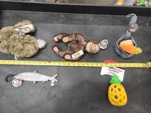 lot 115 image: Lot of (5) Steel Dog Assorted Dog Toys - Sardine, Monkey, Bunny, Potato & Carrots, Pineapple Slow Treater
