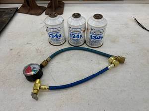 lot 147 image: 3 Cans 134a Refrigerant & Charging Hose