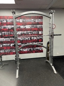lot 4 image: Matrix Smith Machine. Weight Plates not included. Measures 90 W X 58 D X 96 H