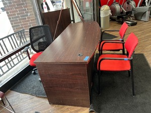 lot 94 image: Bow-top Desk with 2 grommet holes. Includes one 3-drawer pedestal two side chairs and one desk chair on casters