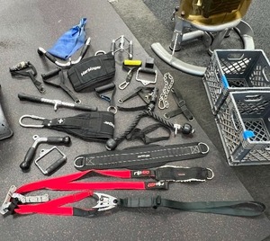 lot 136 image: Weightlifting Cable Attachments Tricep Rope Pull Down, revolving straight bar, Harbinger belts, Rip 60 Suspension Trainer, SPRI cuff